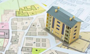 A model of a commercial building placed on a detailed property map, illustrating zoning, parcels, and ALTA survey planning