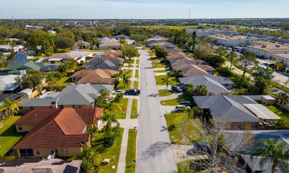 Aerial suburban neighborhood drone view - ALTA SURVEY New York Aerial drone view of a suburban neighborhood that shows how a property survey helps define yards, boundaries, and lot layouts