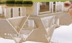 Flooded residential yard after heavy rain - ALTA SURVEY New York Flooded yard near a home after heavy rain showing why an ALTA survey helps identify property risks