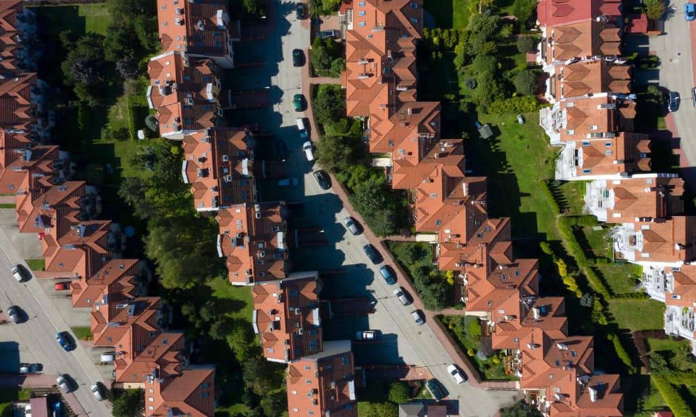 Aerial view of dense rowhouse properties with narrow lots and building footprints that a mortgage survey can help document
