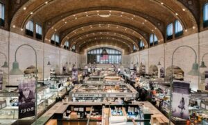 Commercial property surveyor market hall conversion - ALTA SURVEY New York Interior of a historic market hall with multiple vendor stalls and shared customer space, highlighting the layout a commercial property surveyor documents before renovation
